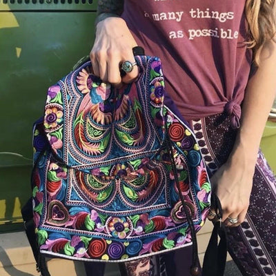 Holding a Colorful Bohemian Backpacks - Embroidered Boho Backpack-Multicolor